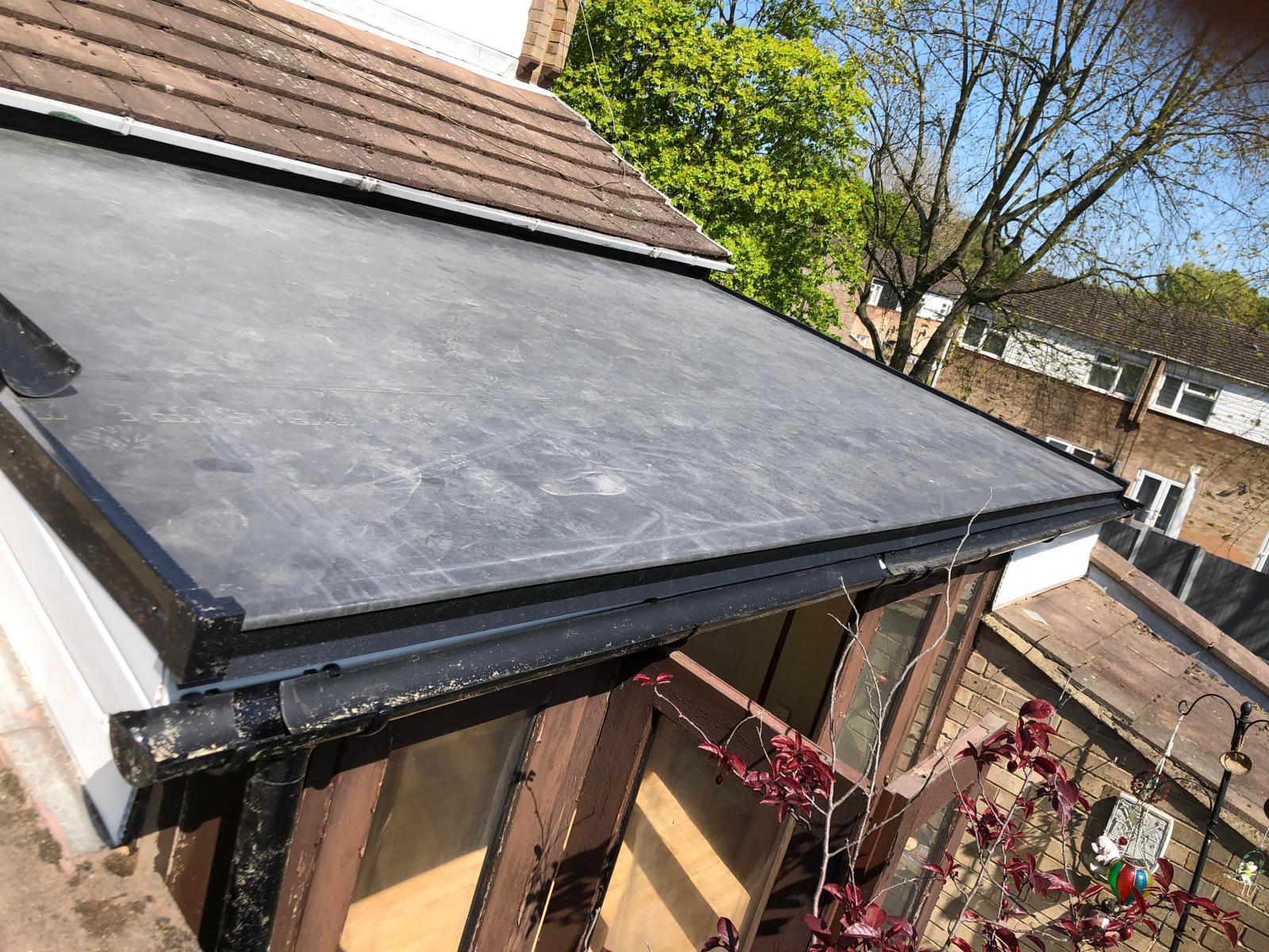 INstallation work for EPDM flat roofing on extension